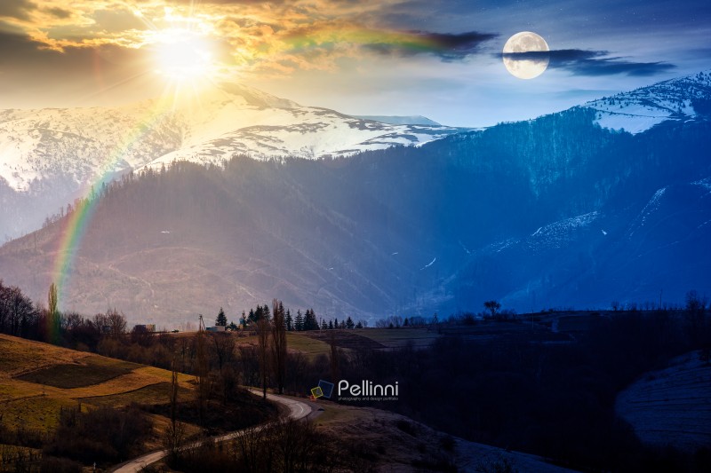 mountains on spring equinox. day and night time change concept. view of countryside landscape with rolling hills and snow covered peak with sun and moon at twilight. duality and transition template