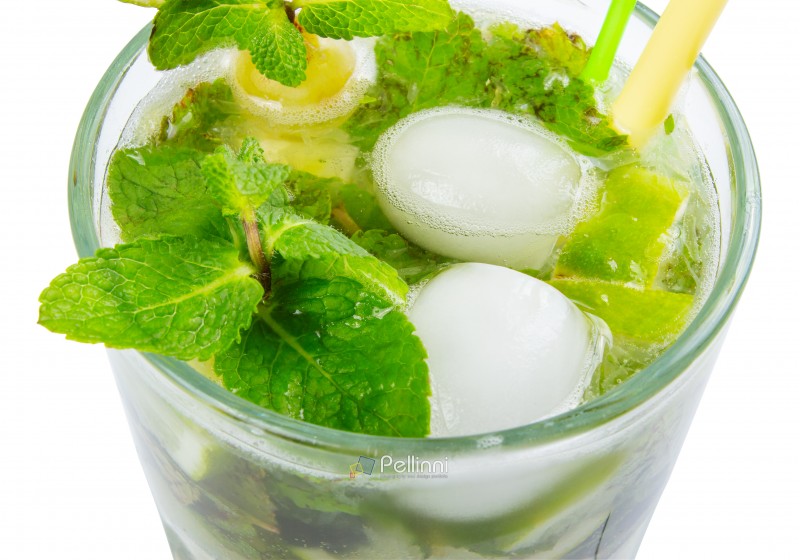 non alcohol mojito with ice, mint and lime in a tall glass. closeup view from the top isolated on a white background