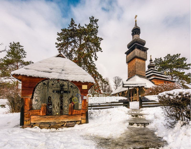 old orthodox wooden church in winter. location Museum of Folk Architecture and Life, Uzhgorod.