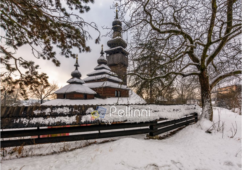 old orthodox wooden church in winter. location Museum of Folk Architecture and Life, Uzhgorod.