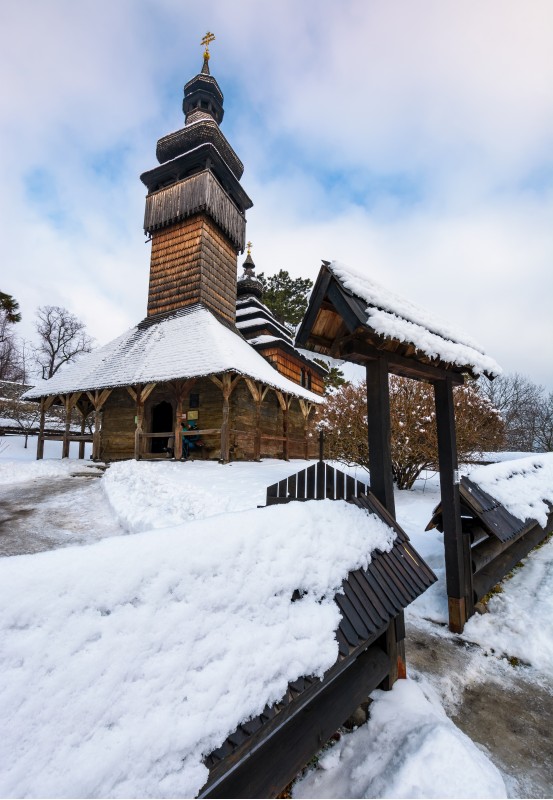 Uzhgorod, Ukraine - JAN 15, 2017: old orthodox wooden church in winter. location Museum of Folk Architecture and Life.