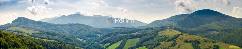panorama of beautiful Carpathian mountains. perfect countryside landscape. rural field on the nearest forested hills. Mighty Borzhava ridge in the distance