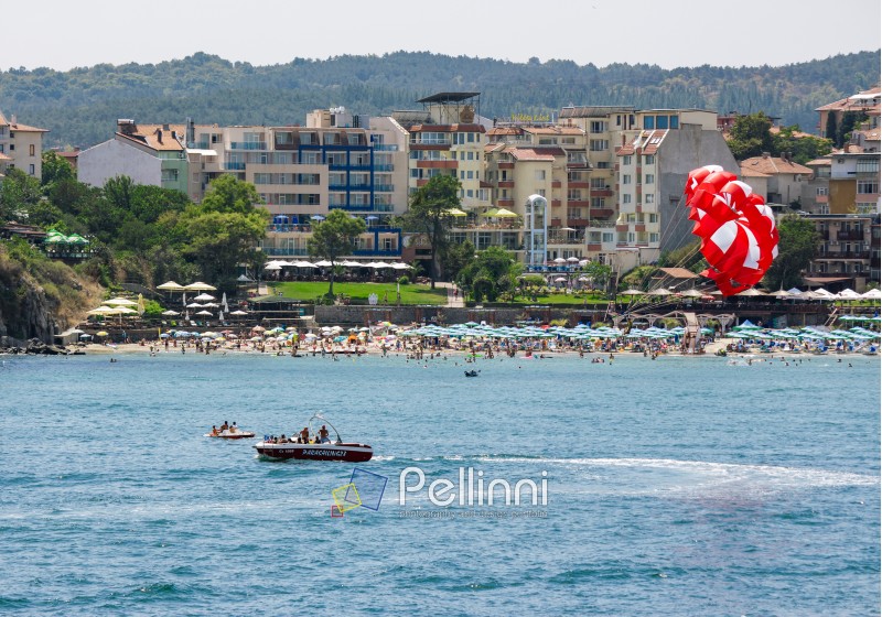SOZOPOL - AUGUST 11: Parasailing over the sea beac  on August 11, 2015 in Sozopol, Bulgaria.  Parachute summer water; sport