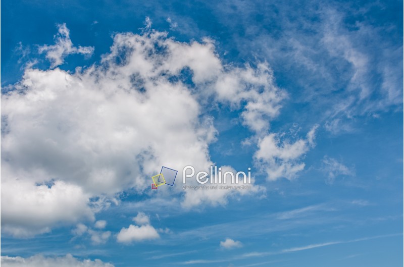 puffy cloud motion on a blue summer sky. beautiful weather background with dynamic cloud arrangement