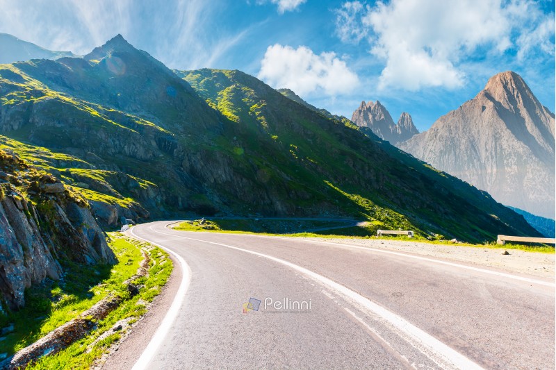 road in mountains with rocky ridge in the distance. composite image. travel by car concept
