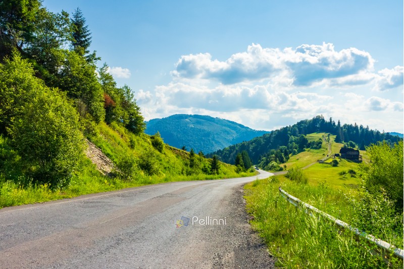 road through rural area in mountains. beautiful summer landscape. travel concept