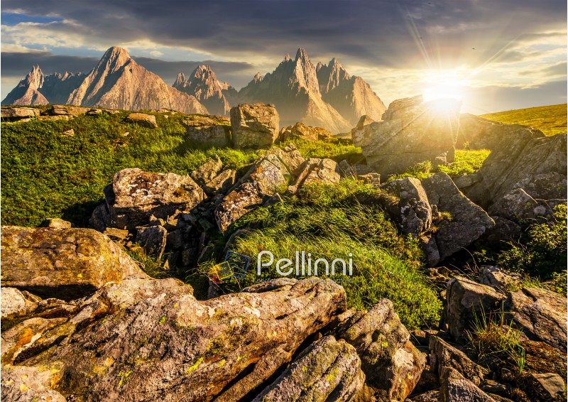 composite image of  rocky peaks and rocks on hillside in Tatras. Gorgeous sunset in summer mountain landscape