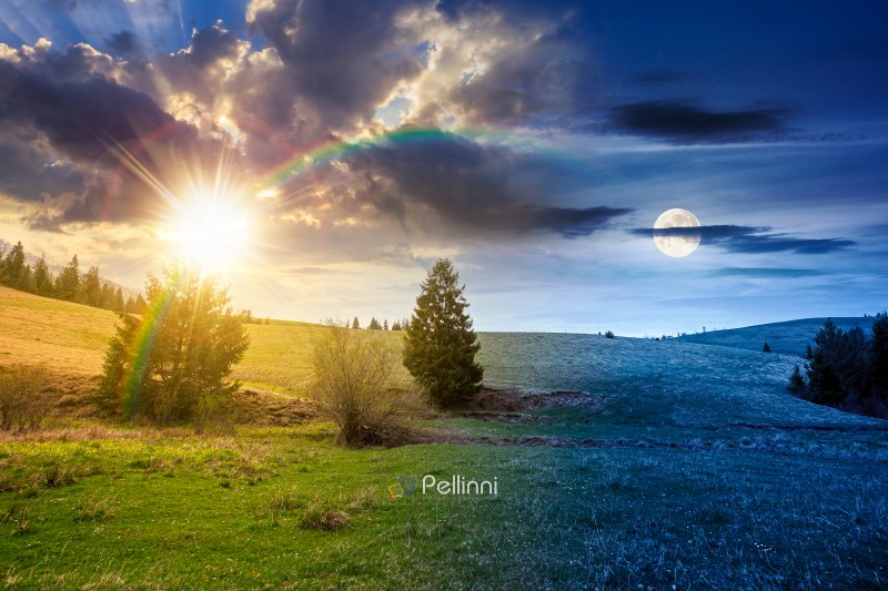 rolling hill with green field under cloudy sky in spring. day an rolling hill with green field under cloudy sky in spring. day and night time change concept. scenic view countryside landscape in mountains with sun and moon at twilight. equality and shift template