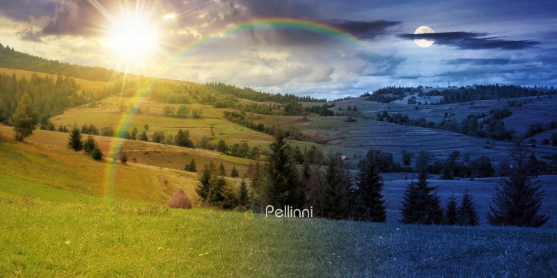 rural fields on autumn equinox. day meet night. sun and moon ove rural fields on autumn equinox. day meet night. sun and moon over trees on the grassy hills at twilight. beautiful countryside scenery of carpathian mountains. clouds on the epic sky