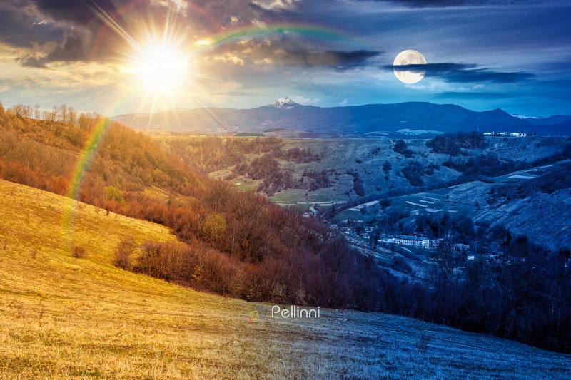 rural landscape with village in valley. day and night time change concept. outdoor adventure in countryside with rolling hill, snowy mountain under sun and moon in spring. equality and shift template