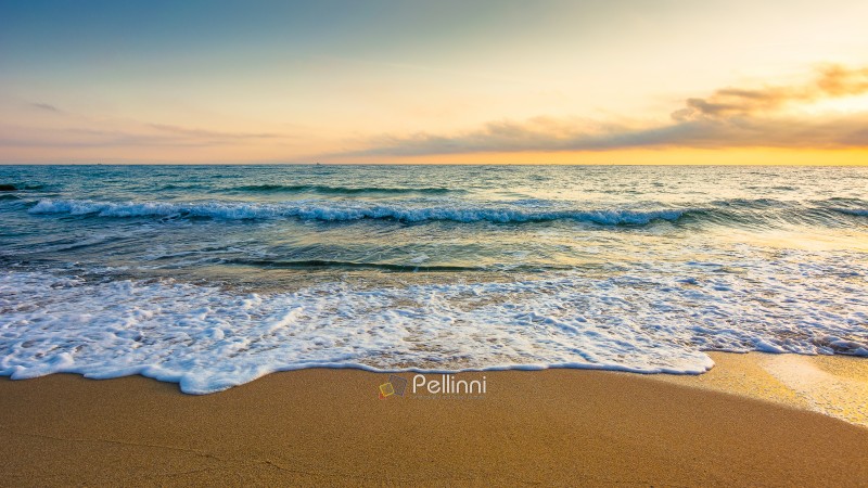 sandy sea beach background on hot summer dawn. low angle view. e sandy sea beach background on hot summer dawn. low angle view. empty seascape scenery with calm waves. beauty seashore wallpaper. peaceful sozopol resort bay photo for advertising