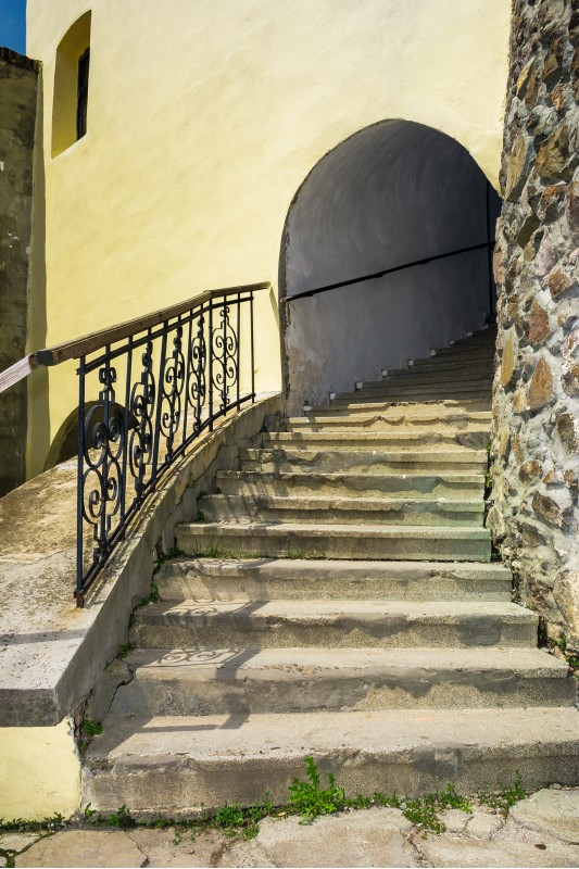steps upstairs in to the clock tower of Palanok Castle. Old fortification now serves as the museum and is popular tourist landmark