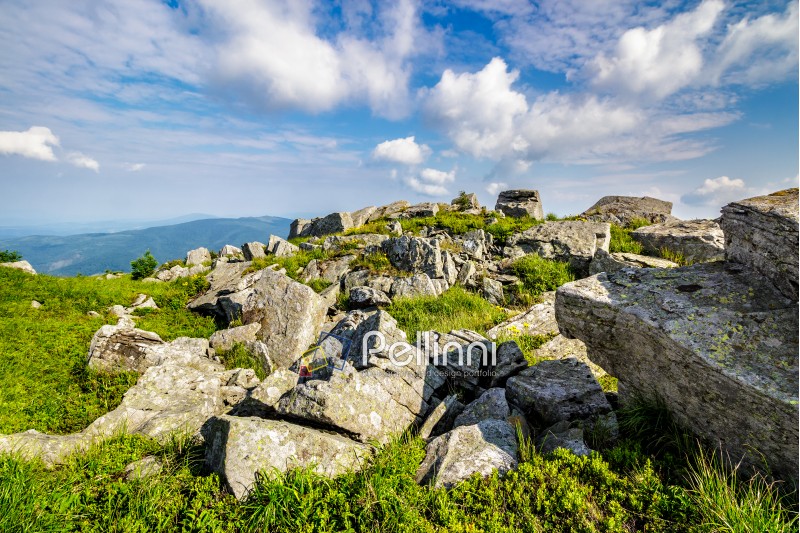 white sharp stones on the hillside on top of mountain range