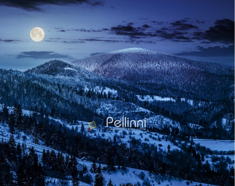 carpathian mountain rural area near peaks in snow on frosty at night in full moon light in winter