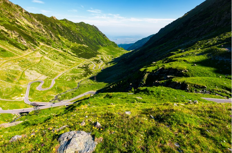 transfagarasan road in mountains of Romania. gorgeous view of the landscape from the edge of a hill. serpentine road with is winding down the valley