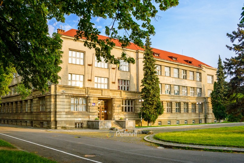 uzhhorod, ukraine - 03 jun 2012: medical faculty building of national university. scenic urban landscape located near embankment of independence (linden alley) in morning light