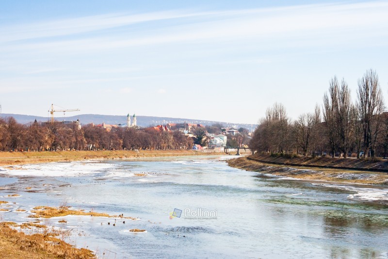 uzhhorod, ukraine - 17 feb, 2008: uzh river in winter. scenic view. beautiful urban scenery. cityscape on a frosty sunny day. white season