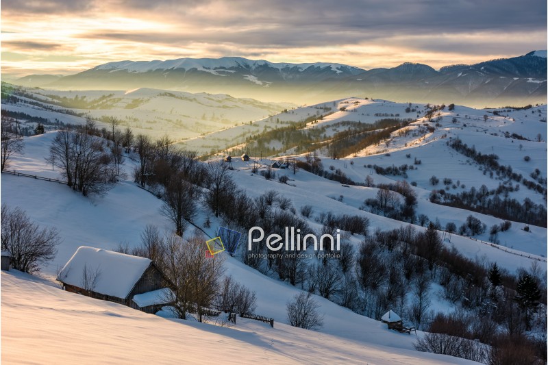 village in mountains on winter sunrise. beautiful landscape in Carpathians
