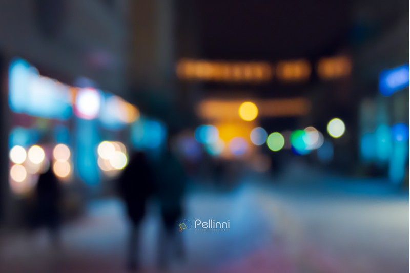 winter city in evening. abstract blur background. christmass shopping concept