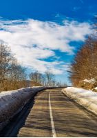 asphalt mountain road in winter. beautiful sunny day