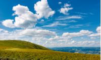beautiful cloudscape over the mountain meadow. beautiful mountainous landscape with gorgeous sky in summer