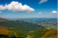 beautiful summer scenery in mountains. view down in to the valley from the top of a mountain