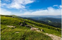 cloudy blue sky over the mountains with rocky hillside. gorgeous nature of Carpathian mountains