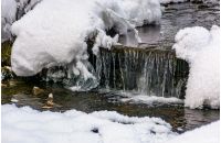 brook with cascades in winter. lovely nature background