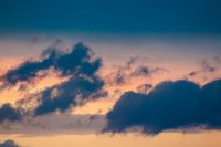 dramatic storm sky with clouds at sunset. dark blue cloudy background at dusk. bad weather forecast during spring. deep moody tones. meteorology air pressure change. gloomy atmosphere