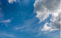 grey cloud on a blue summer sky. dramatic weather background with dynamic cloud arrangement