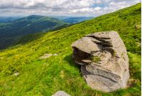 huge rocks on the grassy mountain side. wonderful summer landscape