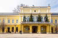 nyiregyhaza, hungary - 07 dec, 2014: town hall on winter holidays. sunny weather. flags and christmas trees on the balcony