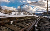 old railroad in winter mountain on a cloudy day. transportation background
