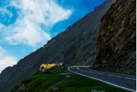 asphalt road on the edge of a hillside. dangerous way in mountains