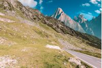 road through mountains with rocky cliff. summer travel concept. composite image with creative toning