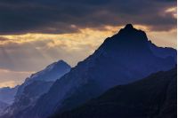 rocky tops of mountain ridge at sunset