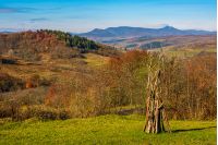 rural grassy fields on hills in gorgeous mountains. stunning countryside landscape in autumn