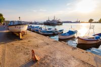 sozopol, bulgaria - 16 aug, 2015: harbor of sozopol at sunset. summer vacation at the black sea. beautiful urban landscape at the seaside of bulgaria in evening light. holiday season