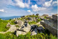white sharp stones on the hillside on top of mountain range