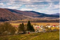 village in valley of Carpathian mountains. lovely springtime scenery on a cloudy day