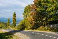 winding countryside road through mountains. lovely autumnal scenery